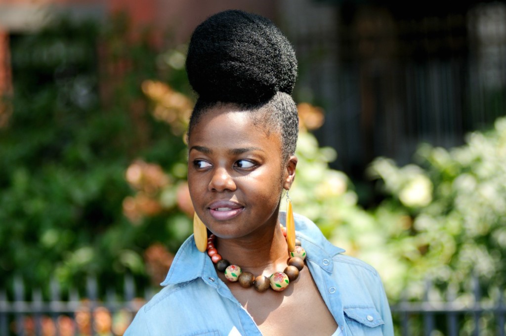 Black woman wearing large high bun hair style